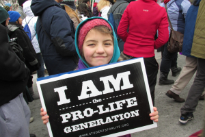 A young girl holds up a pro-life sign at the March for Life in Washington, D.C. (2013) <br/>AP photo