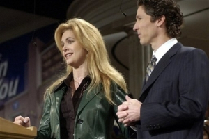 Victoria Osteen stands beside her husband, Lakewood Church pastor Joel Osteen, during services at the church in a Jan. 9, 2005 file photo in Houston. At Lakewood Church, the massive Houston congregation that draws 38,000 people for weekly worship, leader Joel Osteen and his wife, Victoria, are both listed as the pastors. <br/>