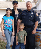 Deputy Darren Goforth pictured with his wife and two children. Goforth was shot and killed on Friday night by 47-year-old Shannon Miles. <br/>Courtesy of Kathleen Goforth