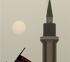 US flags flutter next to a mosque on a main road during the sunset over the Saudi capital Riyadh, Tuesday, June 2, 2009 in preparation for the visit of US President Barack Obama. <br/>(Photo: AP Images / Hassan Ammar)