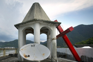 A cut-down cross on a church roof in Zhejiang province. <br/>Mark Schiefelbein/AP
