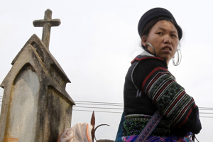 An ethnic Hmong woman attends a Eucharistic adoration ceremony at the Lao Chai church, near Sapa resort town, in Vietnam's northern Lao Cai province March 17, 2013. Eucharistic adoration is a Roman Catholic practice in which the Blessed Sacrament is exposed to be adored by the faithful. Reuters/Kham <br/>