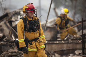Firefighters search for victims in the rubble of a home burnt by the Valley Fire in Middletown, California, September 14, 2015. REUTERS/David Ryder <br/>