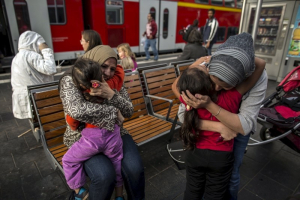 Syrian migrants from Deir al-Zor, Hanine (L), 3, is hugged by her grandmother and Yasmine, 6, by her aunt upon their arrival in Lubeck, Germany in this file picture taken September 18, 2015. REUTERS/Zohra Bensemra/Files <br/>