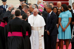 U.S. President Barack Obama (R) welcomes Pope Francis to the United States as the Pontiff shakes hands with dignitaries upon his arrival at Joint Base Andrews outside Washington September 22, 2015. REUTERS/Kevin Lamarque <br/>