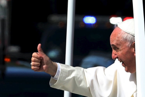 Pope Francis gives a thumbs up to the crowd as he rides down Constitution Avenue in his Popemobile in Washington on day two of his first visit to the United States in Washington September 23, 2015. REUTERS/Gary Cameron <br/>
