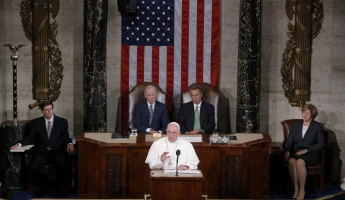 Pope Francis (C) addresses a joint meeting of the U.S. Congress as Vice President Joe Biden (L) and Speaker of the House John Boehner (R) look on in the House of Representatives Chamber on Capitol Hill in Washington September 24, 2015. REUTERS/Jim Bourg <br/>