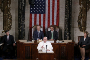 Pope Francis (C) addresses a joint meeting of the U.S. Congress as Vice President Joe Biden (L) and Speaker of the House John Boehner (R) look on in the House of Representatives Chamber on Capitol Hill in Washington September 24, 2015. REUTERS/Jim Bourg <br/>
