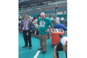 Warren Buffett seen wearing Miami Dolphins Jersey on Sunday.  <br/>Jeff Darlington on Twitter