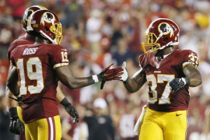 Washington Redskins running back Mack Brown (37) celebrates with Redskins wide receiver Rashad Ross (19) after scoring a touchdown in the fourth quarter against the Jacksonville Jaguars at FedEx Field. The Jaguars won 17-16.  <br/> Amber Searls-USA TODAY Sports