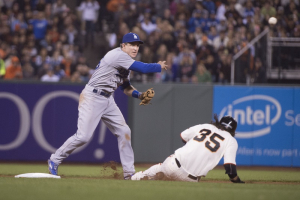 September 28, 2015; San Francisco, CA, USA; Los Angeles Dodgers second baseman Chase Utley (26, left) completes a double play as San Francisco Giants shortstop Brandon Crawford (35) slides into second base during the fourth inning at AT&T Park. Mandatory Credit: Kyle Terada-USA TODAY Sports <br/>