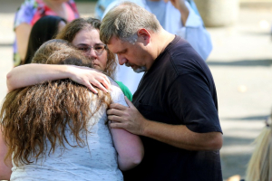 Students are reunited with friends and family after a deadly shooting at Umpqua Community College in Oregon. <br/>AP photo