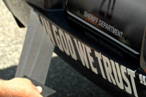 The 'In God We Trust' decals place on police cars across the country have been a source of contention for the atheist group Freedom From Religion Foundation. <br/>KOAM-TV