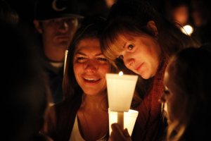 People take part in candle light vigil following the mass shooting at Umpqua Community College in Oregon. <br/>AP photo