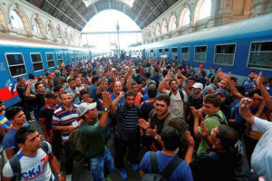 Refugees at Munich train station <br/>Reuters