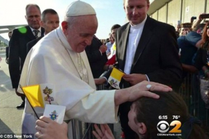 Julia Bruzzese (right) went to JFK Airport to see Pope Francis last month and received his blessing. <br/>CBS News