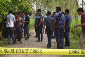 Bangladeshi security officers stand by the site where a Japanese Kunio Hoshi was killed at Mahiganj village in Rangpur district. <br/>AP photo