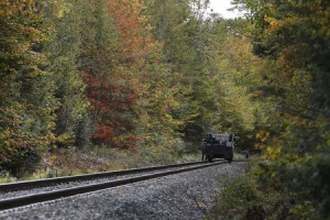 Officials guard the tracks where an Amtrak passenger train derailed in Northfield, Vermont October 5, 2015.  <br/>REUTERS/Brian Snyder