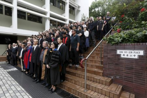 Hundreds of staff and students of the University of Hong Kong stage a silent protest against the university's governing council, which thwarted the appointment of the former law school dean as a university pro-vice-chancellor, inside their campus in Hong Kong, China October 6, 2015. <br />
 <br/>REUTERS/Bobby Yip