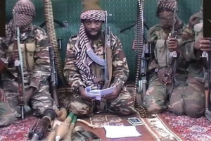 Boko Haram leader Abubakar Shekau, flanked by his men, pledged loyalty to Islamic State earlier this year <br/>AP photo