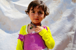 A young Yazidi girl named Muna escaped captivity with her family and is now living in a refugee camp. <br/>AP photo
