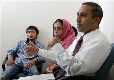 Mohamed Bary, right, his wife Aysha, center, and their son Rilvan answer questions about their daughter Rifqa during an interview Thursday, Aug. 13, 2009, in Columbus, Ohio. Rifqa Bary ran away from home because she thought she would be harmed for converting to Christianity. <br/>(Photo: AP Images / Jay LaPrete)