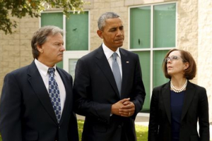 U.S. President Barack Obama speaks immediately after meeting with families of victims of the shooting rampage in Roseburg, Oregon October 9, 2015. Flanking Obama are Rosberg Mayor Larry Rich and Oregon Governor Kate Brown.  <br/>REUTERS/Kevin Lamarque