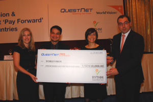 Ms. Donna Imson, Executive Chairperson, QuestNet Ltd. and Trustee of the RYTHM Foundation and Mr. JP Mayer, Managing Director, QuestNet Ltd. present the donation of a total of USD110,000 for “QuestNet Pays Forward “ . Ms. Yolanda Reimer, Asia Corporate Development Officer, World Vision and Mr. Boris Joaquin, Publics in Ministry Director, World Vision Philippines accepted. <br/>