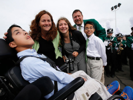 Michael Keating, left, 10, was blessed by Pope Francis after he landed at Atlantic Aviation in Philadelphia on Sept. 26, 2015. Michael suffers from cerebral palsy. He is surrounded by his family, L-R: mother Kristin, sister, Katie, father, Chuck, and twin brother, Chris.  <br/>( CHARLES FOX / Staff Photographer )