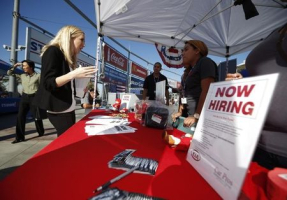 People browse booths at a military veterans' job fair in Carson, California October 3, 2014.  <br/>REUTERS/Lucy Nicholson