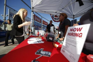 People browse booths at a military veterans' job fair in Carson, California October 3, 2014.  <br/>REUTERS/Lucy Nicholson