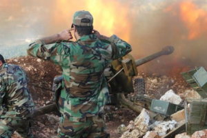 Syrian soldiers fire artillery at rebel positions in Latakia province (10 October 2015) <br/>AP photo
