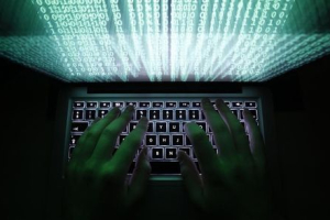 A man types on a computer keyboard in Warsaw in this February 28, 2013 illustration file picture.  <br/>REUTERS/Kacper Pempel/Files