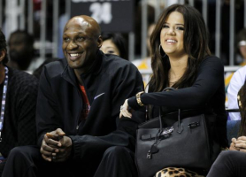 Los Angeles Lakers' Lamar Odom and his wife television personality Khloe Kardashian sit courtside as they attend the 2011 BBVA All-Star Celebrity basketball game as a part of the NBA All-Star basketball weekend in Los Angeles, February 18, 2011. (REUTERS/DANNY MOLOSHOK) <br/>