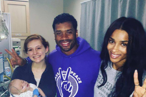 Russell Wilson visits a hospital with girlfriend Ciara. <br/>Facebook page
