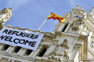 A white banner measuring eight meters across was unfurled from the top of Madrid's landmark post office building, reading: 