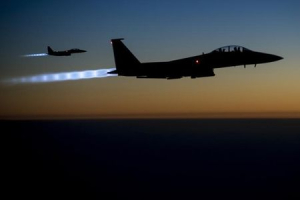 A pair of U.S. Air Force F-15E Strike Eagles fly over northern Iraq after conducting airstrikes in Syria, in this U.S. Air Force handout photo taken early in the morning of September 23, 2014. <br/> REUTERS/U.S. Air Force/Senior Airman Matthew Bruch/Handout