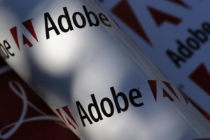 Adobe company logos are seen in this picture illustration taken in Vienna July 9, 2013. REUTERS/LEONHARD FOEGER <br/>