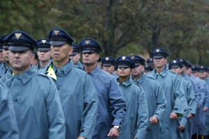 New York State Police officers march in the rain near the Greater Allen A.M.E. Cathedral of New York ahead of the funeral service for slain New York City Police (NYPD) officer Randolph Holder in the Queens borough of New York City, October 28, 2015.  <br/>REUTERS/Brendan McDermid