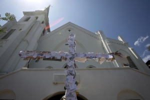 A cross bearing notes of condolence is pictured outside of Emanuel African Methodist Episcopal Church in Charleston, June 21, 2015.  <br/>Reuters