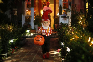 A boy collects candy as he goes trick-or-treating for Halloween in Santa Monica, California, October 31, 2012.  <br/>REUTERS/Lucy Nicholson