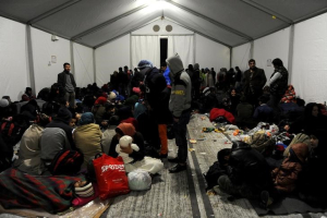 Refugees and migrants rest inside a tent at a camp, as they wait to cross Greece's border with Macedonia near the Greek village of Idomeni, October 27, 2015.  <br/>REUTERS/Alexandros Avramidis
