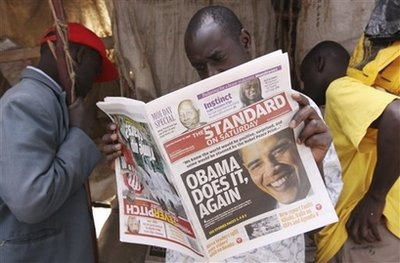 A Kenyan reads the local daily newspaper showing the headlines in Nairobi Saturday, Oct. 10, 2009 following the announcement Friday awarding US President Obama the Nobel peace prize for 2009. The announcement was met with joy in Kenya, which has a special regard for Obama, the son of a Kenyan economist and an American anthropologist. <br/>(Photo: AP Images / Khalil Senosi)