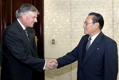 In this Korean Central News Agency photo released by Korea News Service in Tokyo on Thursday, Oct. 15, 2009, Rev. Franklin Graham, the son of veteran evangelist Billy Graham, left, is greeted by Kim Yong Dae, vice-president of the Presidium of the Supreme People's Assembly of North Korea, as Graham paid a courtesy call on Kim at the Mansudae Assembly Hall in Pyongyang, North Korea, on Wednesday, Oct. 14, 2009. The American brought one of the first shipments of U.S. aid to the country in months <br/>(Photo: Korean Central News Agency via Korea News Service) 