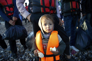 Refugees wait to get on a dinghy to sail off for the Greek island of Chios from the western Turkish coastal town of Cesme, in Izmir province, Turkey, November 4, 2015.  <br/>Reuters
