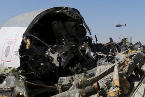 An Egyptian military helicopter flies over debris from a Russian airliner which crashed at the Hassana area in Arish city, north Egypt, in this file photograph dated November 1, 2015. <br/> REUTERS/Mohamed Abd El Ghany/files