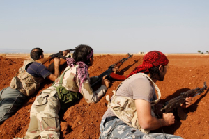 Rebel fighters take positions at the frontline during what they said were clashes with Islamic State militants in the town of Marea in Aleppo's countryside October 3, 2014.  <br/>Reuters
