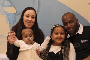 Baby Layla (L) is seen with her parents, Lisa and Ashleigh, and her older sister Reya at Great Ormond Street Hospital (GOSH) in London in this November 4, 2015 handout photo by the hospital released on November 5, 2015.  <br/>REUTERS/Great Ormond Street Hospital/Handout via Reuters.