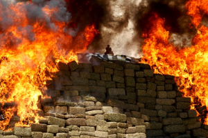 A burning pile of marijuana and other drugs are being incinerated at a camp of the Mexican Army's 28th infantry battalion in Tijuana, Mexico, August 18, 2015. <br/>Reuters