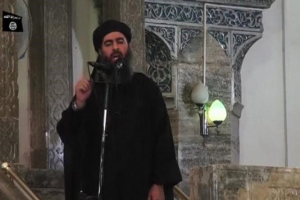 Abu Bakr al-Baghdadi at a mosque in the centre of Iraq's second city, Mosul, according to a video recording posted on the Internet on July 5, 2014, in this still image taken from video.  <br/>Reuters